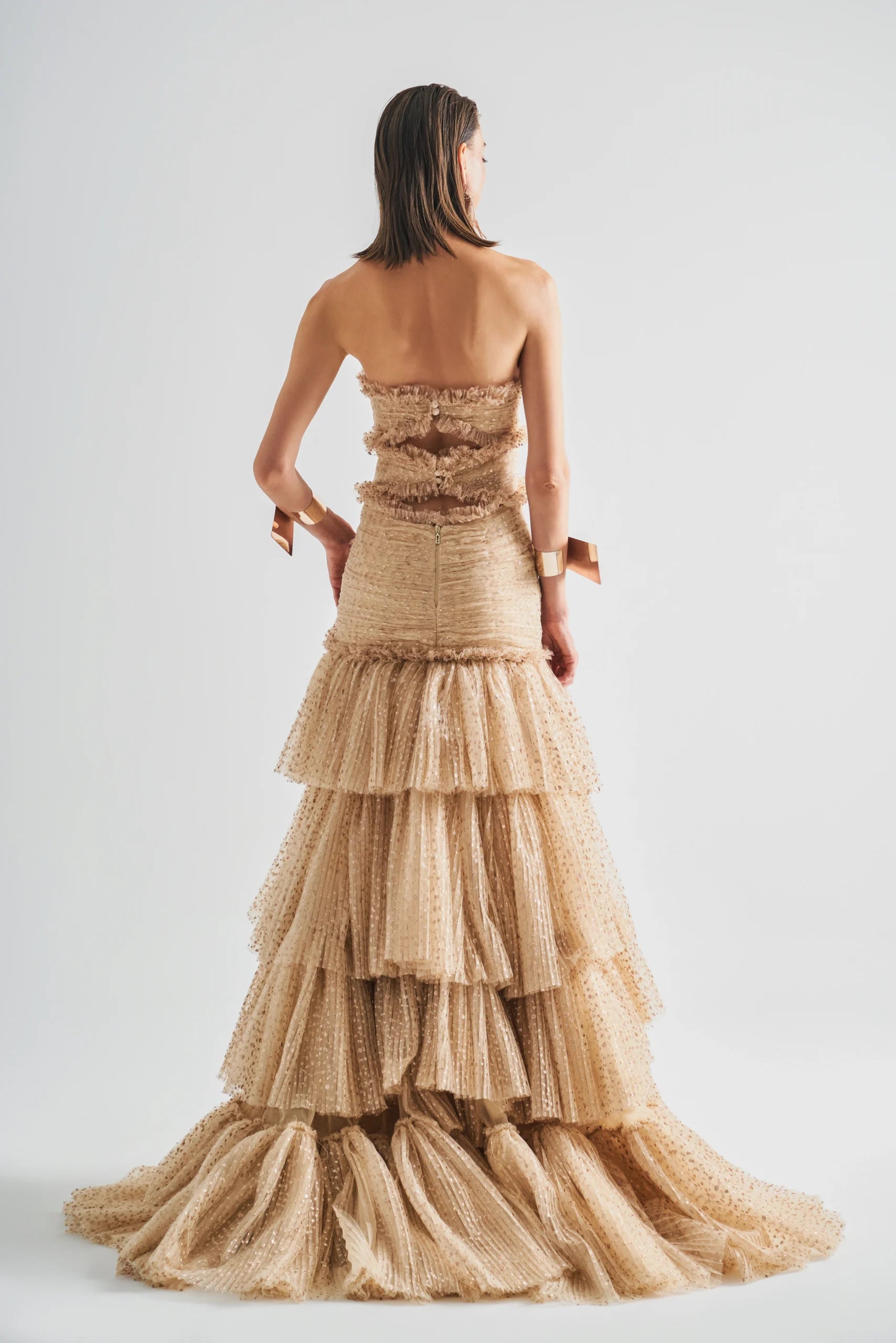 Strapless High-Low Dress features sheer point d’esprit tulle