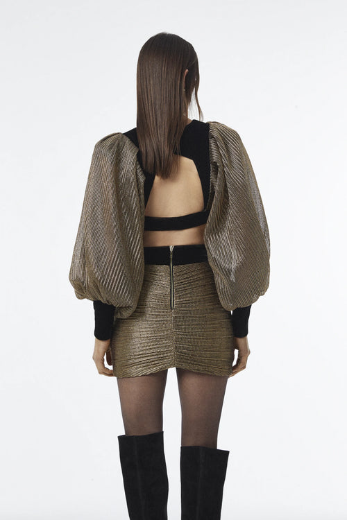 V-neck crop blouse with draped sleeve detailing.